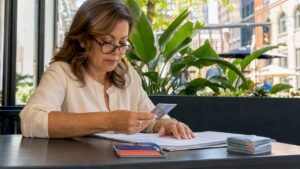 Notary verifying real estate documents in office